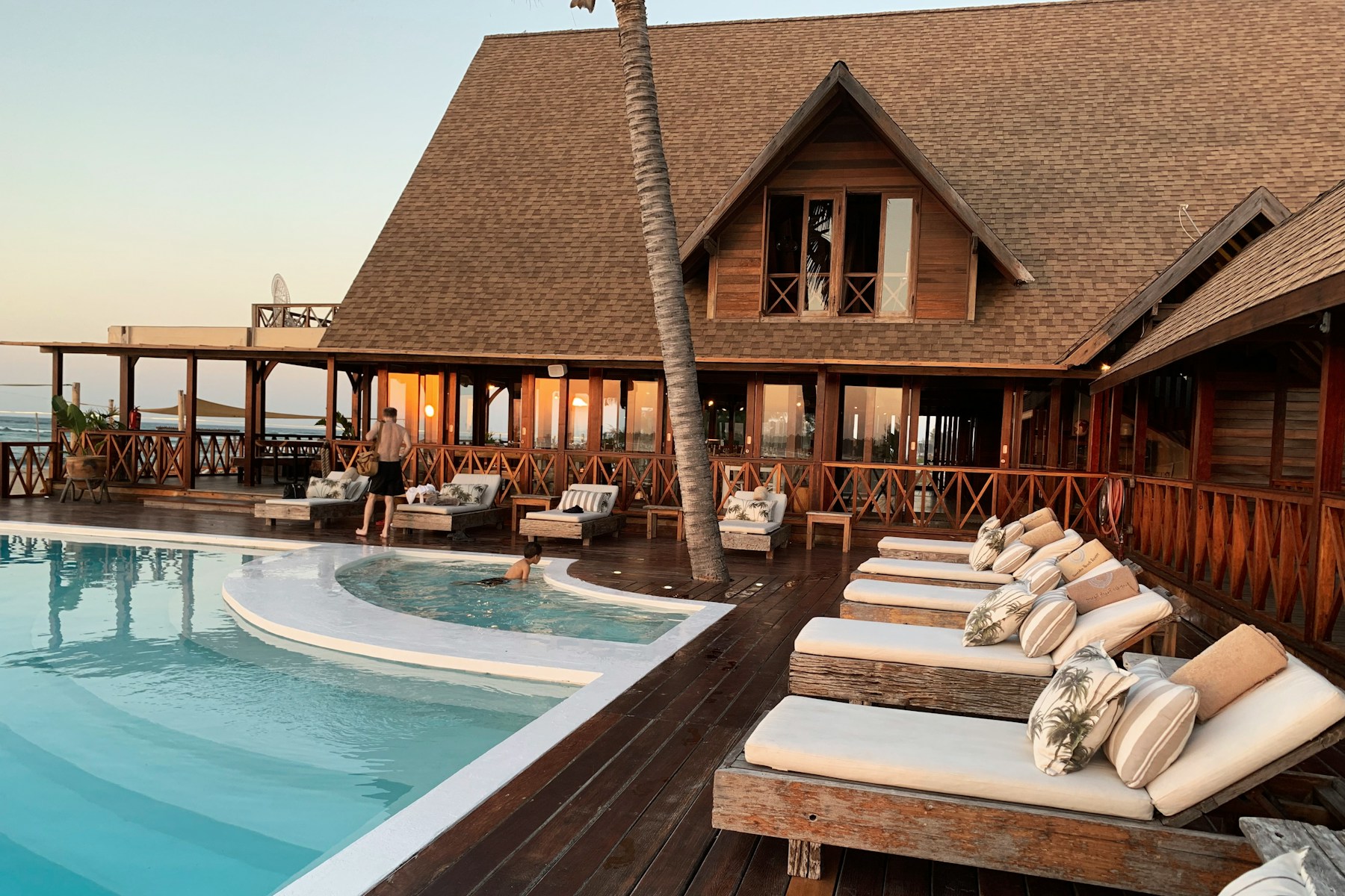 A considered resort pool in warm daylight